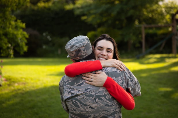 Soldier embracing female partner