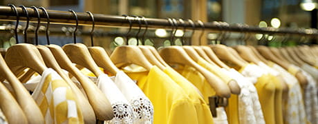 Clothes on hangers in a
                department store